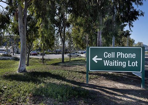 Cell phone waiting lot sign