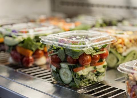 Prepacked salad on cooler shelf