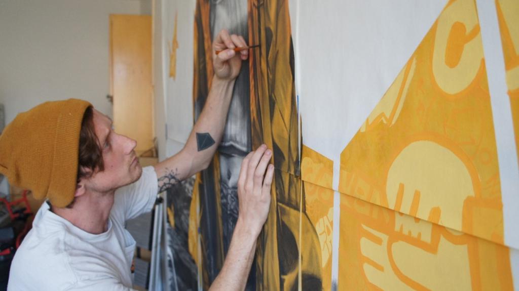 Artist James Thistlethwaite working in his studio