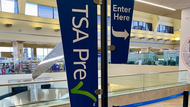 TSA PreCheck banners in airport terminal