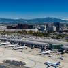 Aerial view of John Wayne Airport, with mountains in background